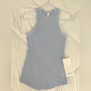 New with tag lululemon hold tight tank, size 2 never worn. Blue linen color
